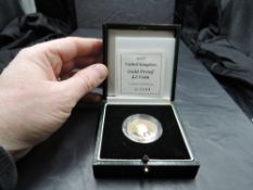 A Royal Mint United Kingdom 1997 Queen Elizabeth II Gold Proof £2 Coin, in plastic capsule and