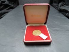 A United Kingdom 1897 Queen Victoria Gold Sovereign, Melbourne Mint, in folding case
