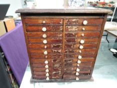 A wooden 24 Drawer Coin Cabinet, World Coins, many many Countries seen, old to modern, jam packed,
