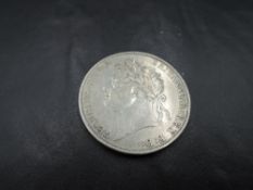 A 1822 George IV Silver Crown, Tertio on edge, in good condition, needs viewing