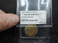 A 1782 George III GB Gold Guinea in NGS plastic wallet, Altered Surface