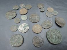 A small collection of possible Roman Coins including one Silver coin