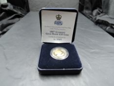 A Royal Mint Guernsey 1997 Queen Elizabeth II Gold Proof £25 Coin, in plastic capsule and folding