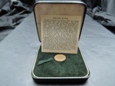 A 1965 Elizabeth II Isle of Man Gold Half Sovereign, in original folding case with card page