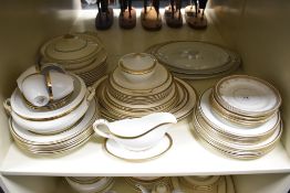 Three part dinner services, including Alfred Meakin with green motif to cream ground, another Alfred