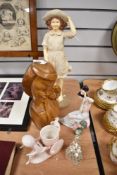 A mid-century carved wooden bust, depicting a young oriental girl, appears to be mahogany, and sold