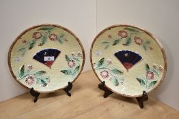 Two Victorian Majolica plates, having moulded decoration of basket weave, with fan to centre, bees
