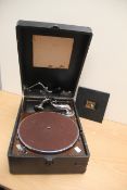 A vintage gramophone with a number of old shellac 78's in case - jazz related