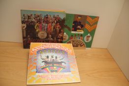 A lot two Beatles albums - a US magical mystery tour with booklet and a nice flip back laminated Sgt