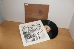A VG/VG copy of In Through The Out Door by Led Zeppelin with Brown Bag outer