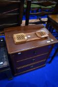 A modern reproduction Regency mahogany effect chest of three bedroom drawers and an adjustable