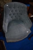 A blue dralon button back nursing chair