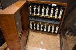 An interesting show cases containibg vintage ceramic fuses , stamped Tucker Telac, England, case