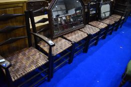A set of eight (six plus two) stained frame ladder back chairs having woven cane seats