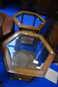 A pair of modern stained frame hexagonal occasional tables with glass top and cane undertier