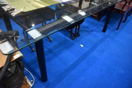 A modern glass dining table approx 210 x 100cm