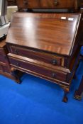 An early 20th Century bureau having ball and claw feet, width approx 78cm