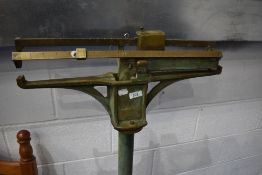 A vintage cast iron balance scale, possibly doctors or similar