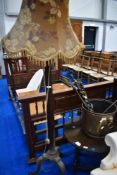 An early 20th Century mahogany standard lamp having trefoil base with paw feet