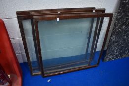 A set of four vintage glazed shop cabinet doors