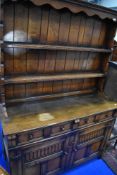 A reproduction oak dresser, of nice proportions, approx 120cm width, labelled Titchmarsh and