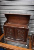 A Victorian mahogany wall cupboard having carved doors, width approx 43cm
