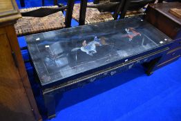 A Japanesque black laquered coffee table, with horse decoration, approx 117 x 46cm, height 47cm