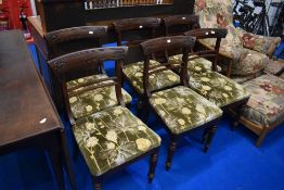 A set of six 19th Century railback dining chairs having later upholstery to drop on seats, on fluted