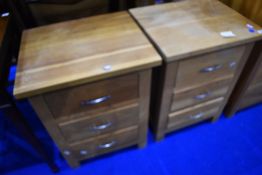 A pair of modern golden oak bedside chests of three drawers, each approx. W49 D41 H67cm