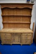 A Victorian and later stripped pine dresser having sideboard base, dimensions base approx. 152 x