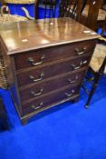 An early to mid 20th Century Georgian style dwarf chest of four drawers having brass drop handles,