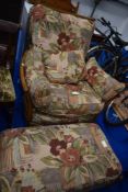A mid stain Ercol easy chair and footstool