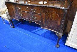 An early 20th Century mahogany sideboard having ledge back and carved border, width approx. 180cm
