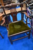 A Georgian oak carver chair having green dralon upholstered seat, width approx. 68cm