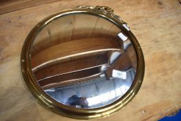 A vintage brass circular wall mirror having convex glass, diameter approx. 34cm