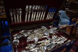 A reproduction Regency canteen on cabriole legs , containing selection of Cooper Ludlam cutlery