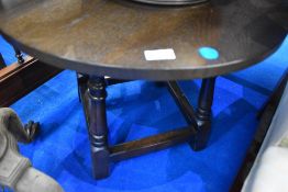 A vintage dark oak circular coffee table, diameter approx. 61cm