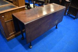 A 19th Century mahogany gateleg table on cabriole legs, width approx 136cm (some water damage)