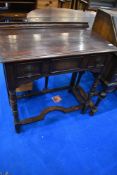 A late 19th or early 20th Century oak Jacobean style side table