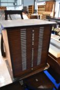 A 19th Century mahogany specimen cabinet having shallow drawers and number drawer handles,