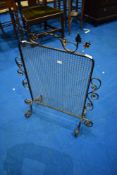 A traditional wrought iron and wirework fireguard, approx 63 x 82cm