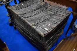 A large wicker laundry basket approx. 92 x 63 x 63cm