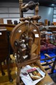 A traditional spinning wheel by Rappard and Company (Wee Peggy) , height approx. 95cm, with