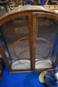 A 1930s walnut veneerd dome top display cainet, height approx. 196cm