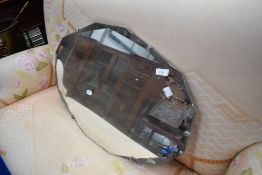 A vintage frameless wall mirror, approx. 74 x 49cm
