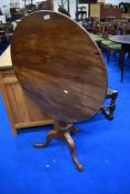 A Victorian mahogany snap top pedestal table having cicrcular top turned column and triple splay