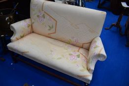 A mahogany framed settee in the traditional settle style, width approx. 143cm