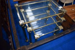 A vintage brass and glass nest of three tables, max dimensions 64 x 40cm, 48cm height
