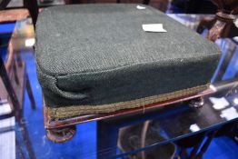 A 19th Century upholstered footstool of square form , having mahogany frame with rosette feet, width