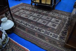 A traditional nomad style rug, approx 300 x 176cm